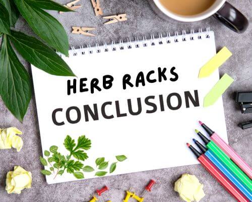 Sign on table with colored pens and herb leaves "Herb Racks Conclusion"