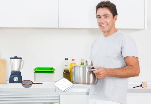 Man with large pot in kitchen with other equipment to make tofu